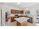 A kitchen space with light tile flooring, stainless steel appliances, and light countertops at 5269 Deer Creek Dr, Indianapolis, IN 46254