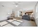 Sun-drenched living room with a neutral color palette, fireplace, and comfortable seating at 5269 Deer Creek Dr, Indianapolis, IN 46254