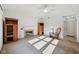 Cozy living room with fireplace, light carpet, and natural lighting at 5269 Deer Creek Dr, Indianapolis, IN 46254