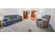 Inviting living room features plush carpeting and a comfortable couch, perfect for relaxation at 5269 Deer Creek Dr, Indianapolis, IN 46254