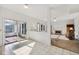 Bright living room with fireplace and access to screened in porch at 5269 Deer Creek Dr, Indianapolis, IN 46254
