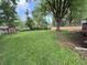 Expansive backyard featuring a large grassy area and a storage shed at 5460 N Park Dr, Indianapolis, IN 46220