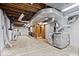 Spacious unfinished basement with exposed beams and utilities, offering potential for customization at 5460 N Park Dr, Indianapolis, IN 46220