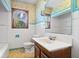 Bathroom with a white tiled wall and a light blue border at 5460 N Park Dr, Indianapolis, IN 46220