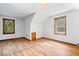 Attic bedroom featuring hardwood floors and two windows providing natural light at 5460 N Park Dr, Indianapolis, IN 46220