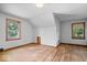 Attic bedroom featuring hardwood floors and a window providing natural light at 5460 N Park Dr, Indianapolis, IN 46220