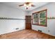 Cozy bedroom with hardwood floors and natural light from a large window at 5460 N Park Dr, Indianapolis, IN 46220