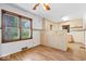 Bright kitchen with classic cabinetry, laminate floors, and large window at 5460 N Park Dr, Indianapolis, IN 46220