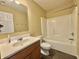 Functional bathroom with a single sink vanity, a mirror, and a shower-tub combo for convenience at 5571 Auburndale Dr, Bargersville, IN 46106