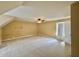 Spacious carpeted bedroom with ample natural light, featuring a window and a ceiling fan for added comfort at 5571 Auburndale Dr, Bargersville, IN 46106