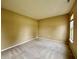 Bedroom with neutral-colored walls, plush carpeting, and a window at 5571 Auburndale Dr, Bargersville, IN 46106