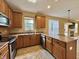 Well-equipped kitchen with wood cabinets, stainless steel appliances, and counter space at 5571 Auburndale Dr, Bargersville, IN 46106