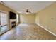 Spacious living room with modern flooring, fireplace, and plenty of natural light at 5571 Auburndale Dr, Bargersville, IN 46106