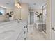 Contemporary bathroom with double sink vanity, stylish lighting, and a separate tub at 5917 Bartley Dr, Noblesville, IN 46062