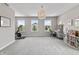 Large bonus room with lots of windows providing natural light, and a bike at 5917 Bartley Dr, Noblesville, IN 46062