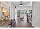 Bright entryway with hardwood floors leading to a spacious open-concept living area at 5917 Bartley Dr, Noblesville, IN 46062