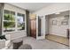 Inviting living room featuring ample natural light from large windows and stylish furnishings at 5917 Bartley Dr, Noblesville, IN 46062