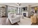 Bright living room featuring a fireplace, TV, lots of natural light, and comfortable seating at 5917 Bartley Dr, Noblesville, IN 46062