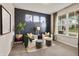 Stylish sitting room with designer wallpaper, cozy seating, and ample natural light at 5917 Bartley Dr, Noblesville, IN 46062