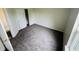 Well-lit bedroom featuring neutral walls, plush carpeting, closet, and bright window view at 5938 Tybalt Ln, Indianapolis, IN 46254