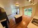 Kitchen featuring an island, stainless steel appliances, and sliding glass doors to the backyard at 5938 Tybalt Ln, Indianapolis, IN 46254