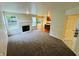 Open living area with a fireplace and seamless access to the kitchen, offering a great entertainment space at 5938 Tybalt Ln, Indianapolis, IN 46254