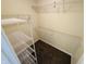 Walk-in closet with wire shelving and neutral carpeting for ample and organized storage space at 5938 Tybalt Ln, Indianapolis, IN 46254
