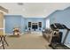 Finished basement with a cozy sofa, treadmill, and play area perfect for Gathering time at 6050 Acorn Dr, Columbus, IN 47201