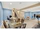 Finished basement features carpeted floors, dining area, stairs to upper level, and a bar area, perfect for entertaining at 6050 Acorn Dr, Columbus, IN 47201