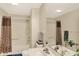 Cozy bathroom showcases a shower-tub, single vanity, toilet, and a decorative mirror at 6050 Acorn Dr, Columbus, IN 47201
