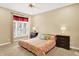 Comfortable bedroom with a large window, natural light, and carpeted floors at 6050 Acorn Dr, Columbus, IN 47201