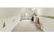 Bright bonus room with beige carpet, playful wall decor, and a ceiling fan provides additional flexible space at 6050 Acorn Dr, Columbus, IN 47201
