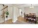 Inviting dining room with hardwood floors, a chandelier, and stairs leading to the second floor at 6050 Acorn Dr, Columbus, IN 47201