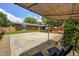 Backyard features a basketball court, covered patio, and a seating area perfect for outdoor entertaining at 6143 Schoolwood Dr, Indianapolis, IN 46224