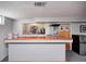 Basement bar features a refrigerator, sink, and plenty of counter space at 6143 Schoolwood Dr, Indianapolis, IN 46224