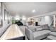Finished basement with shuffleboard, bar and sofa offers a great space for entertainment at 6143 Schoolwood Dr, Indianapolis, IN 46224