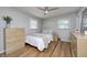 Bedroom with hardwood floors, ceiling fan, and neutral decor at 6143 Schoolwood Dr, Indianapolis, IN 46224