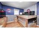 Bedroom with custom-built loft bed, hardwood floors, and creative wall decor at 6143 Schoolwood Dr, Indianapolis, IN 46224