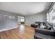 Spacious living room with hardwood floors and comfortable seating, creating a relaxing atmosphere at 6143 Schoolwood Dr, Indianapolis, IN 46224