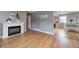 Inviting living room featuring hardwood floors, a cozy fireplace, and neutral decor for a modern touch at 6143 Schoolwood Dr, Indianapolis, IN 46224