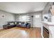 Cozy living room with a comfortable sofa, natural light, and hardwood floors, perfect for relaxation at 6143 Schoolwood Dr, Indianapolis, IN 46224