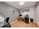 Well-lit home office with hardwood floors and ample workspace at 6143 Schoolwood Dr, Indianapolis, IN 46224