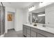 A stylish bathroom featuring a double vanity, and a glass-enclosed shower at 6448 Schad Dr, Noblesville, IN 46062
