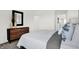 Stylish bedroom with a dresser and mirror, a comfortable bed, and soothing decor at 6448 Schad Dr, Noblesville, IN 46062