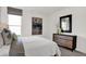 Inviting bedroom with a dresser and stylish decor, alongside a picturesque window view at 6448 Schad Dr, Noblesville, IN 46062