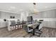 Modern dining area features contemporary lighting fixtures and stylish seating near the kitchen at 6448 Schad Dr, Noblesville, IN 46062