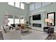 Spacious living room with high ceilings, a cozy fireplace, and plenty of natural light at 6448 Schad Dr, Noblesville, IN 46062