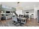 Open-concept living spaces with dining area, kitchen, and modern decor with high ceilings at 6448 Schad Dr, Noblesville, IN 46062