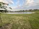 Community pond view showcasing several homes in the neighborhood at 6729 Birmingham Ave, McCordsville, IN 46055