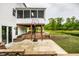 Backyard view with a patio, basketball hoop and view of the lake at 6771 Woodcliff Cir, Zionsville, IN 46077